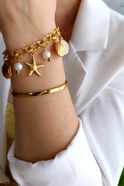 Bracelet femme en perles nacrées, bijoux femme en acier inox, bracelet femme en acier inox pas cher, bijoux artisaux français, bijoux de créateurs français, bijoux fantaisie hypoallergéniques, bijoux artisanaux français abordables, bijoux fantaisie hypoallergéniques, bracelet femme grosses perles, site de bijoux fantaisie en acier inox pas cher, site de bijoux faits en france, bijoux de main en acier, bijoux de main fantaisie en acier et nacre